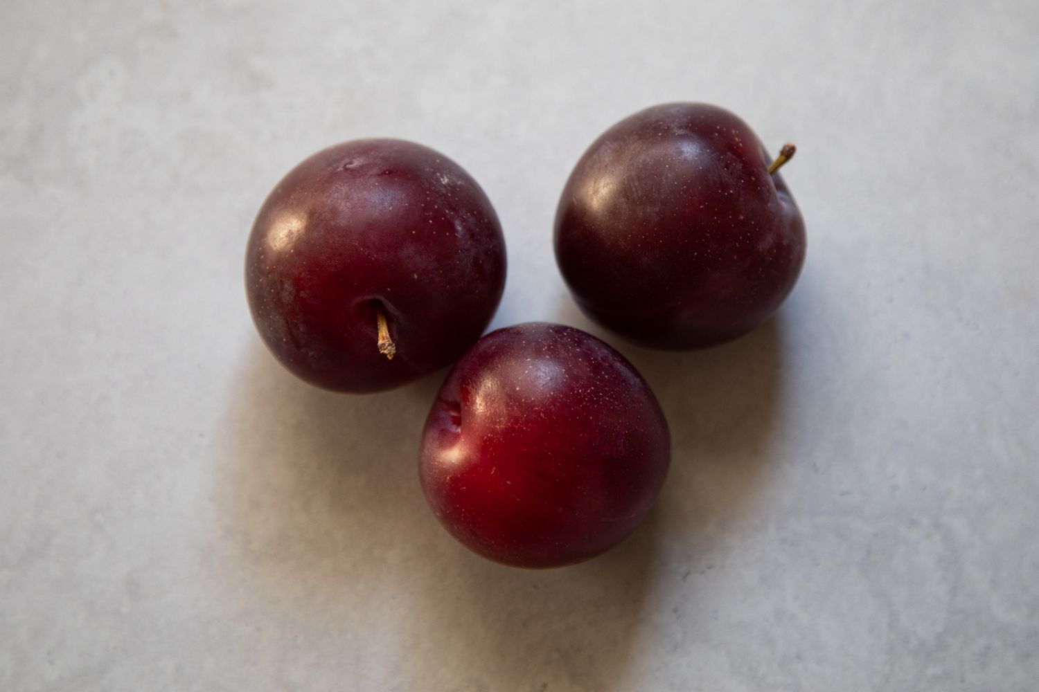 Three purple plums
