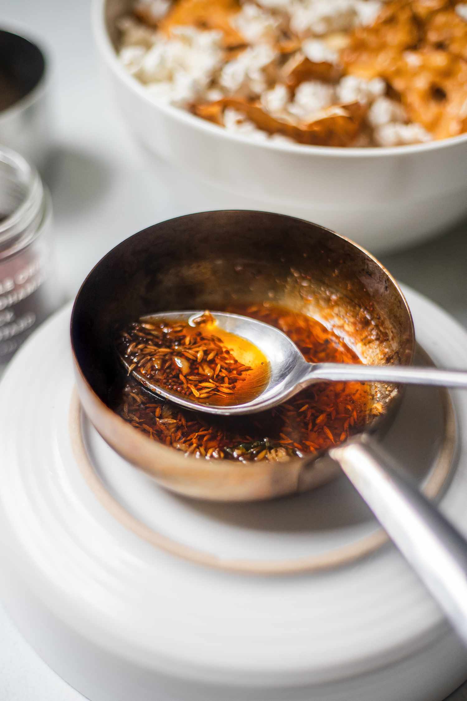 Blooming spices in oil in a pan