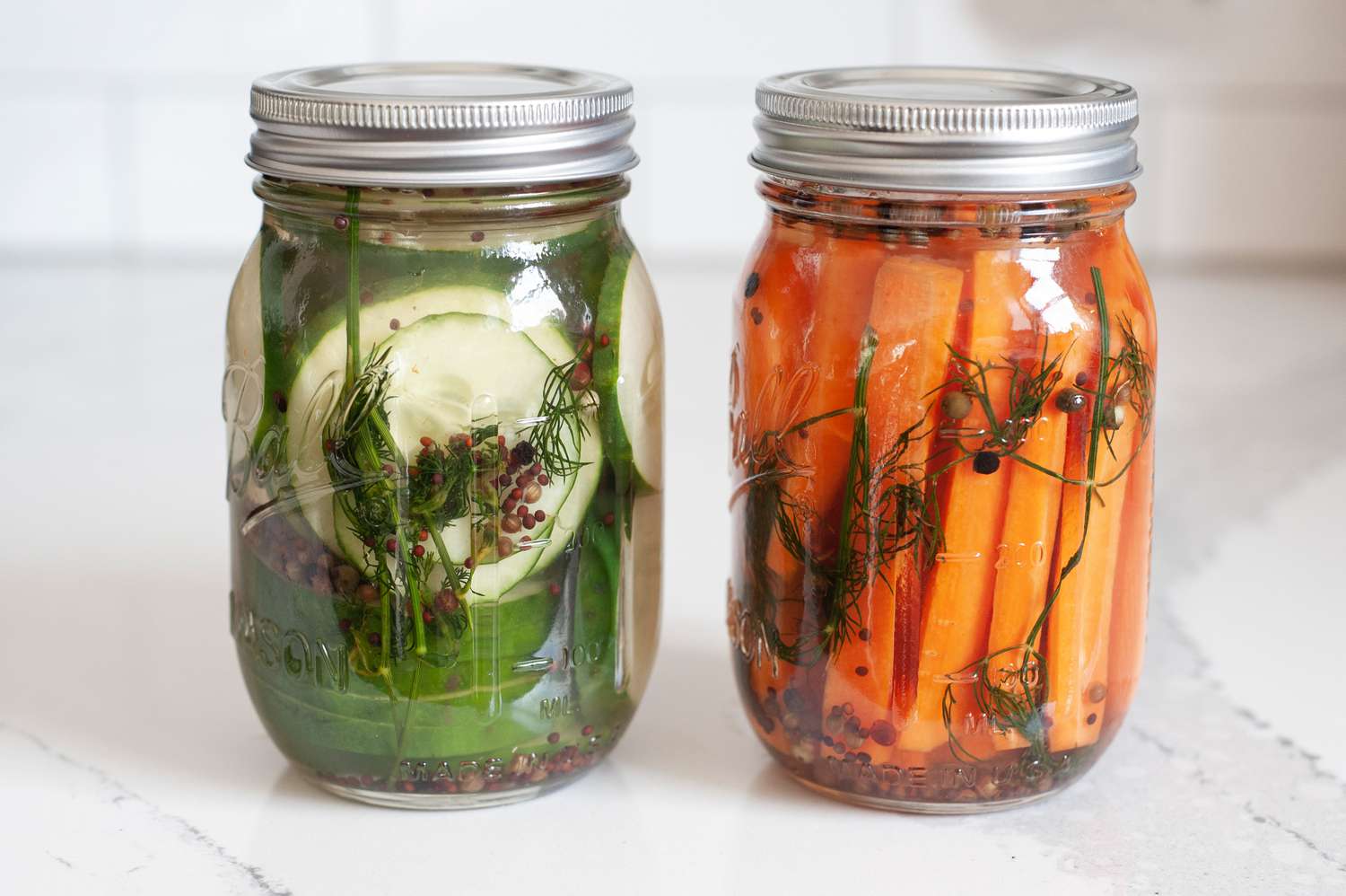 Jars of Quick Pickles (One with Cucumbers and Another with Carrots)