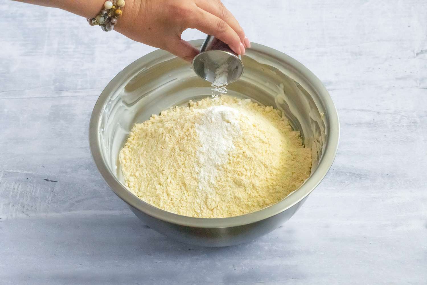 Baking Powder Added to Bowl of Masa (Tamales Dough) Ingredients