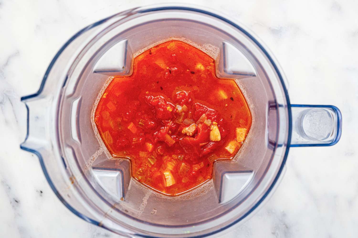 Blend tomato and broth for classic tomato sauce