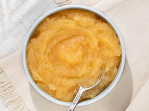 Microwave Applesauce in a bowl with a spoon