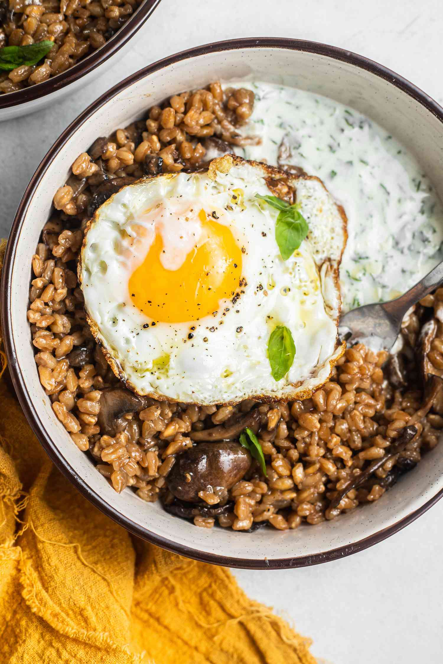 Farro, Mushroom, and Egg Grain Bowl with a Utensil