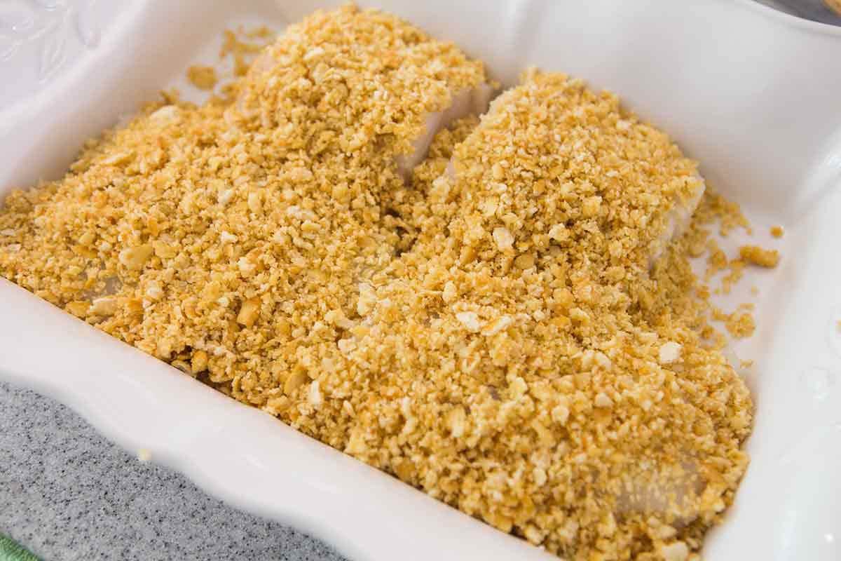 Cod Fillets covered in Ritz crackers in baking dish for baked cod recipe