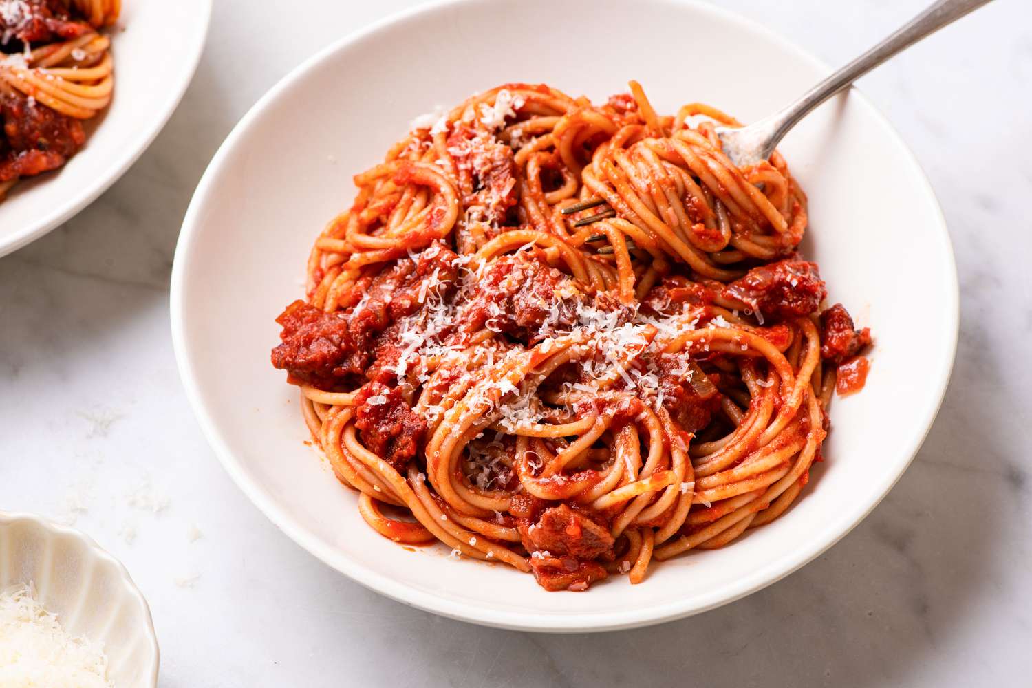 Marry Me Pasta in a bowl, garnished with graded parmesan