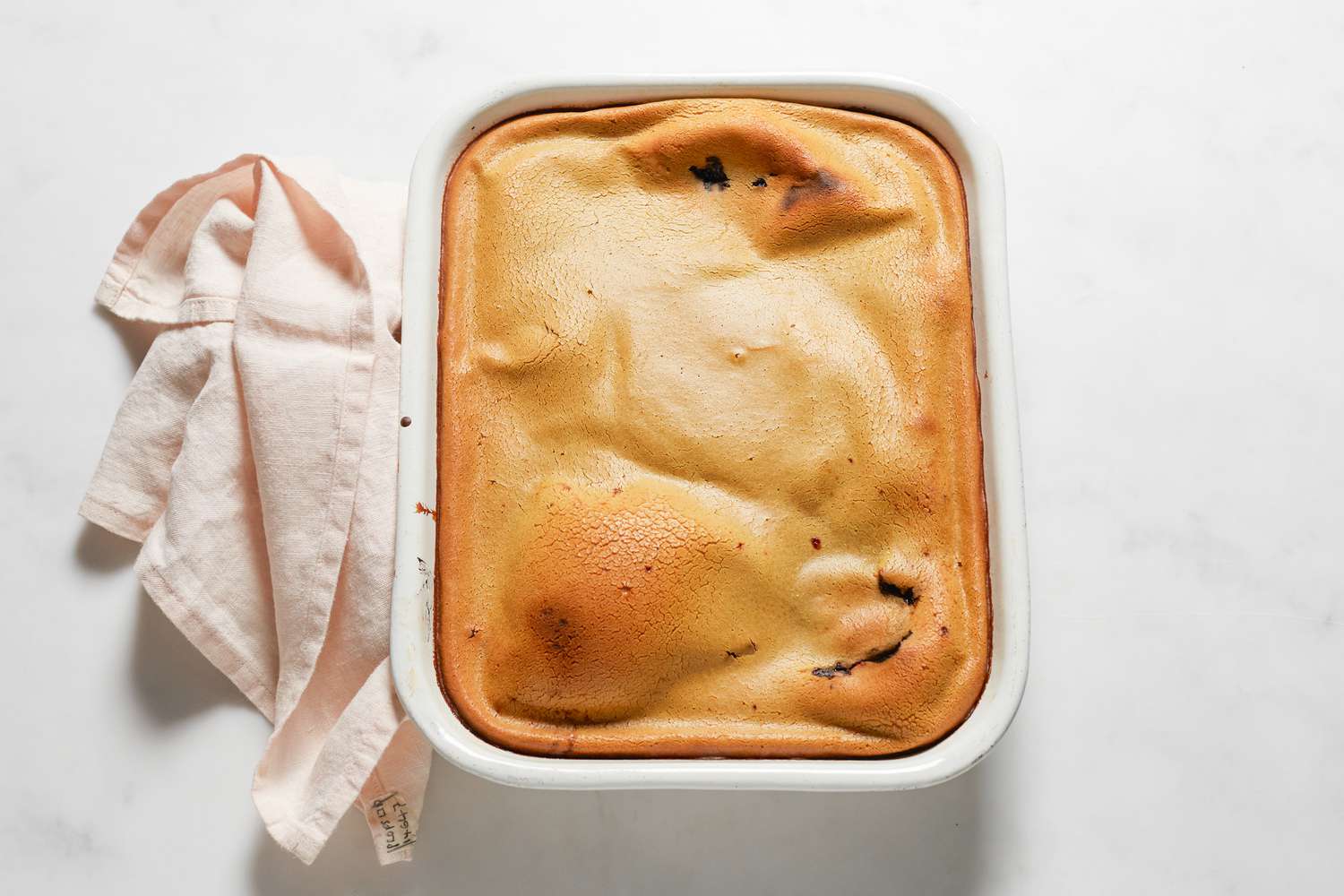 Baked sticky rice cake with red bean paste in a baking dish.