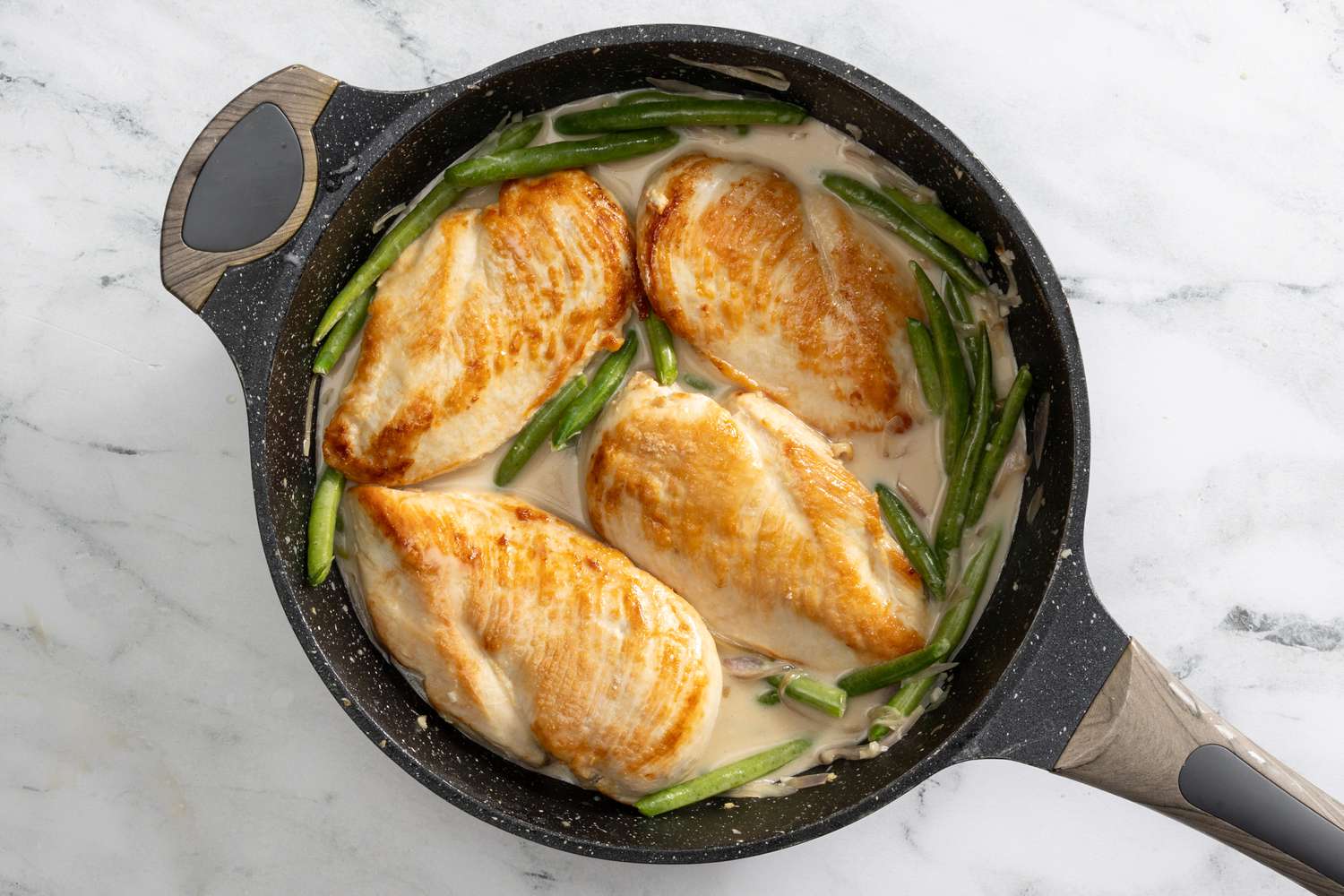 chicken added back to the pan after coconut milk was added to the vegetables for creamy coconut lime chicken recipe 