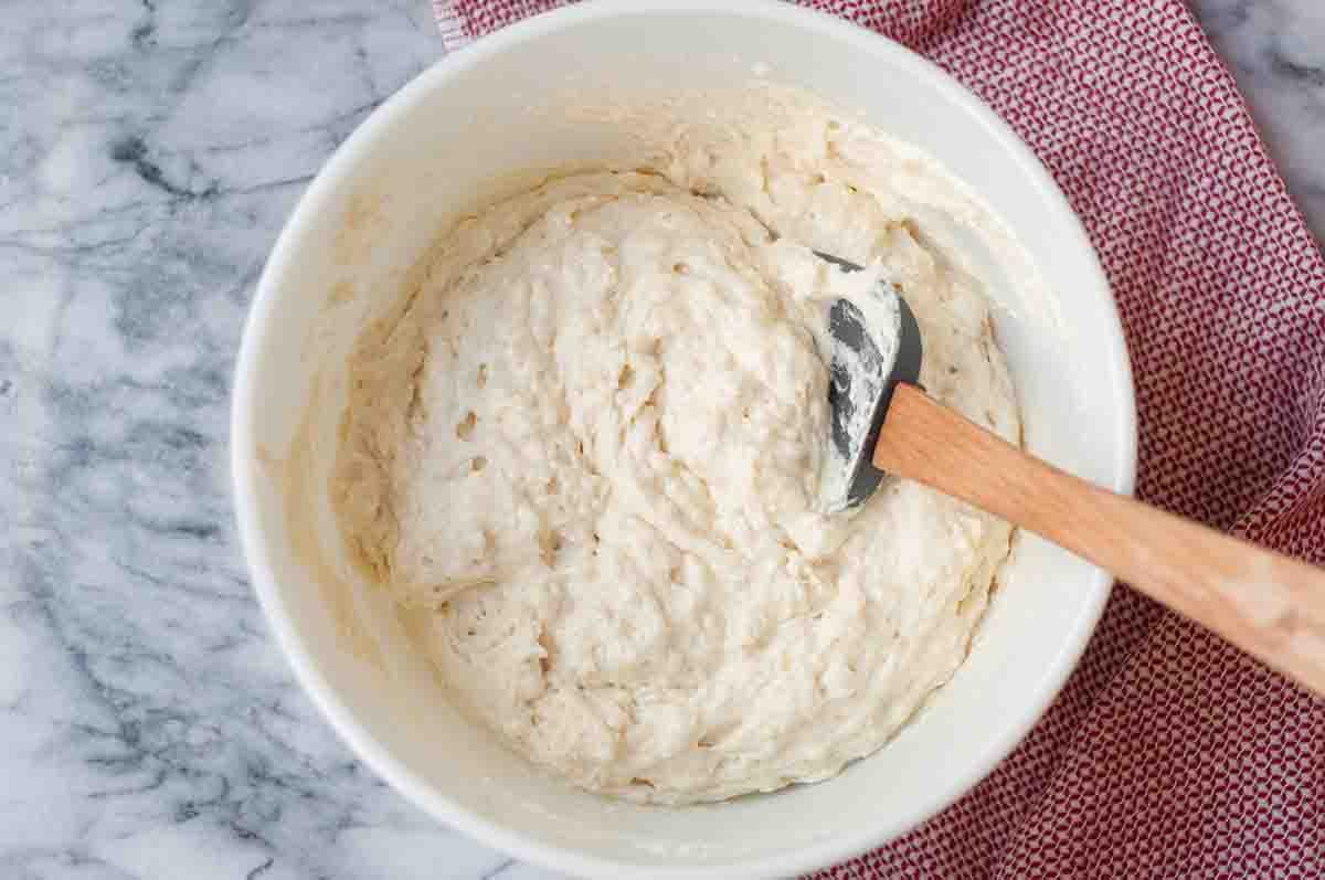 Mix together the batter for the waffle recipe until no more streaks of flour remain