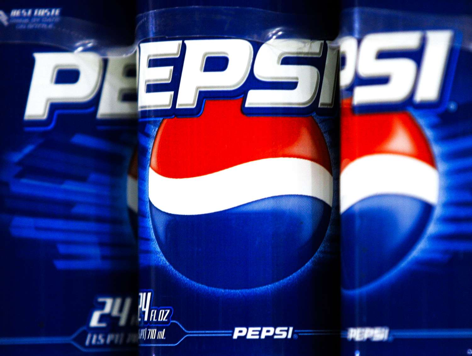Pepsi soda cans with closeup view of branding and logo arranged side by side
