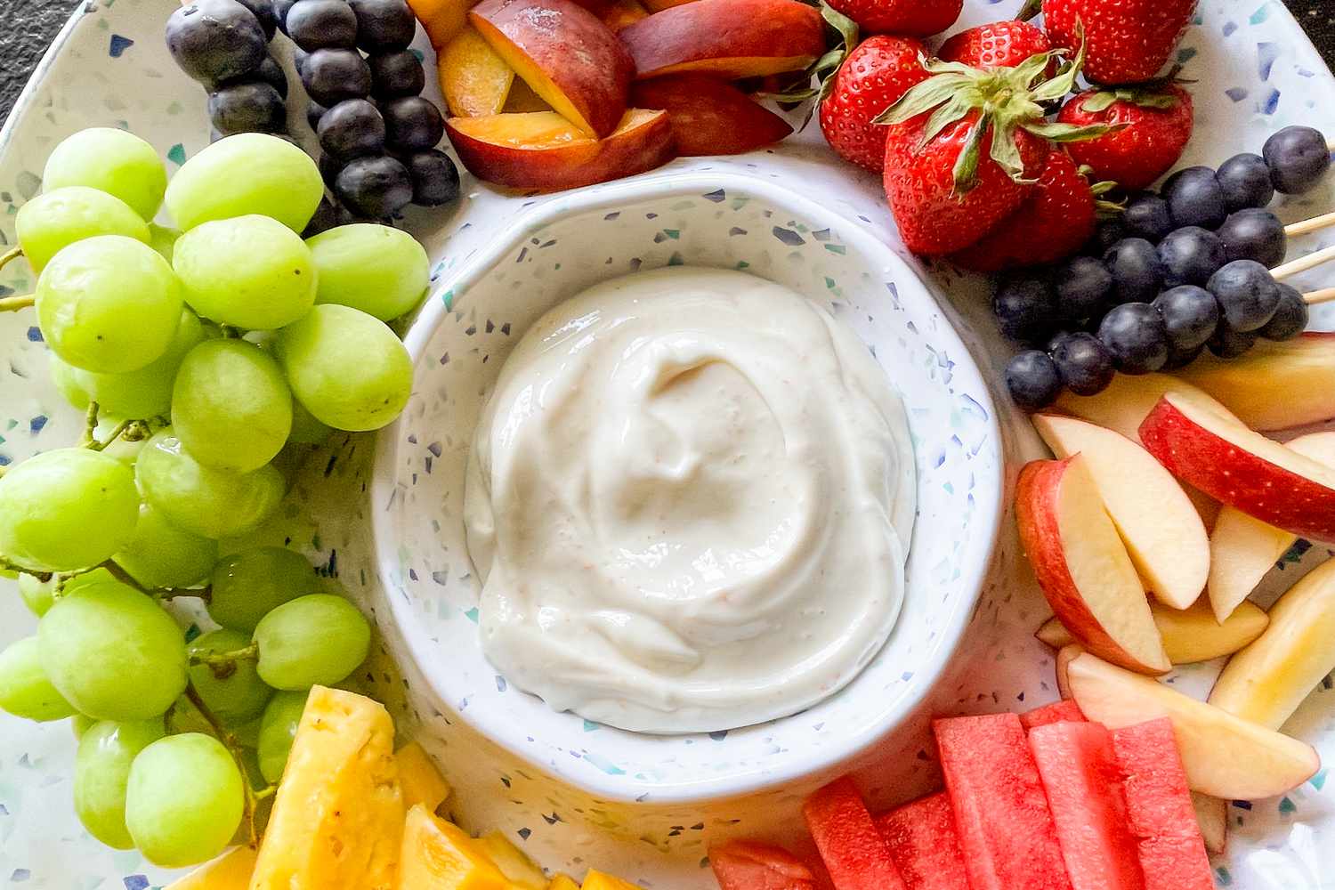 2-ingredient dip and freshly cut fruit on a dip plate