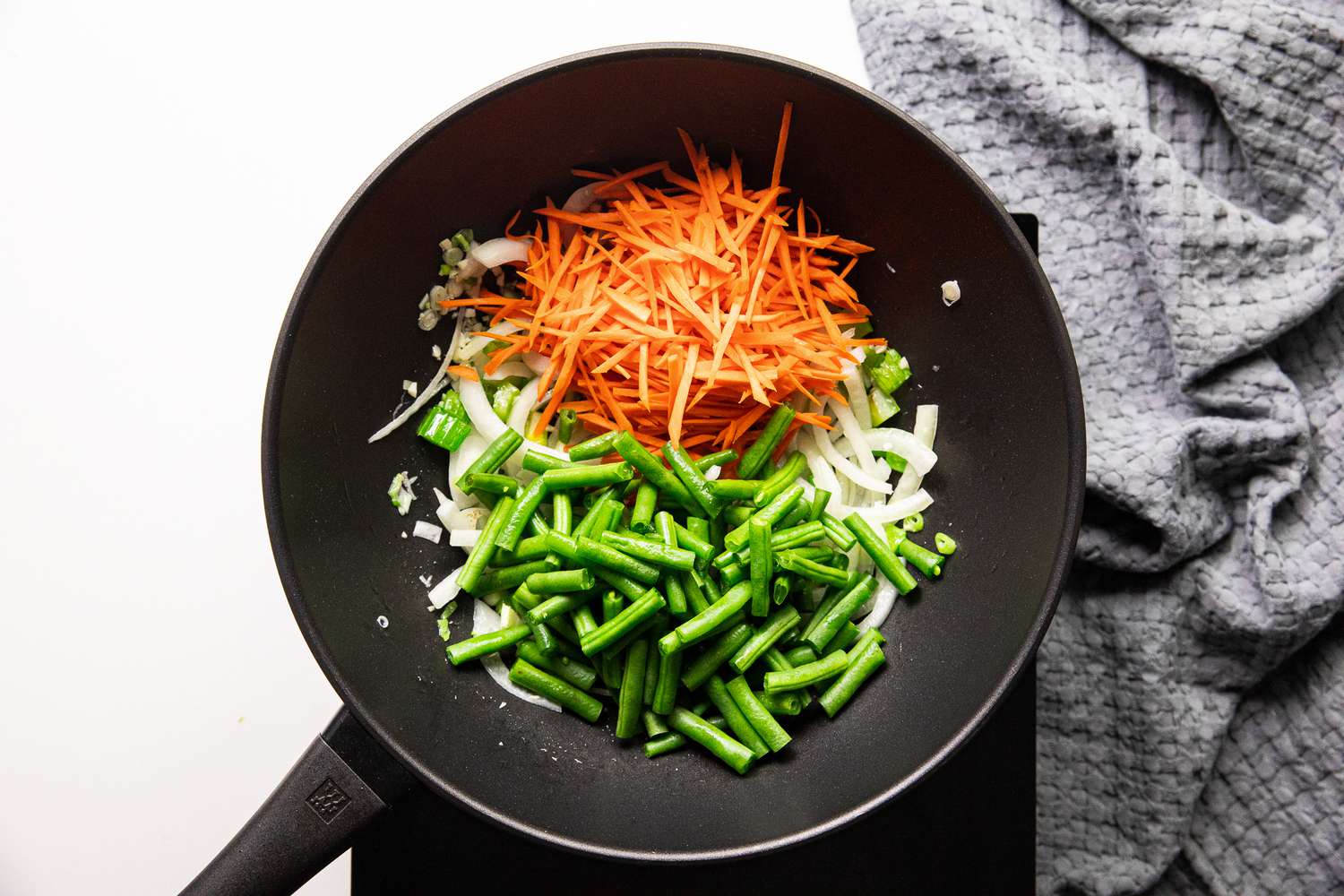 Carrots and Green Beans Added to Wok for Pancit Bihon with Pork Recipe