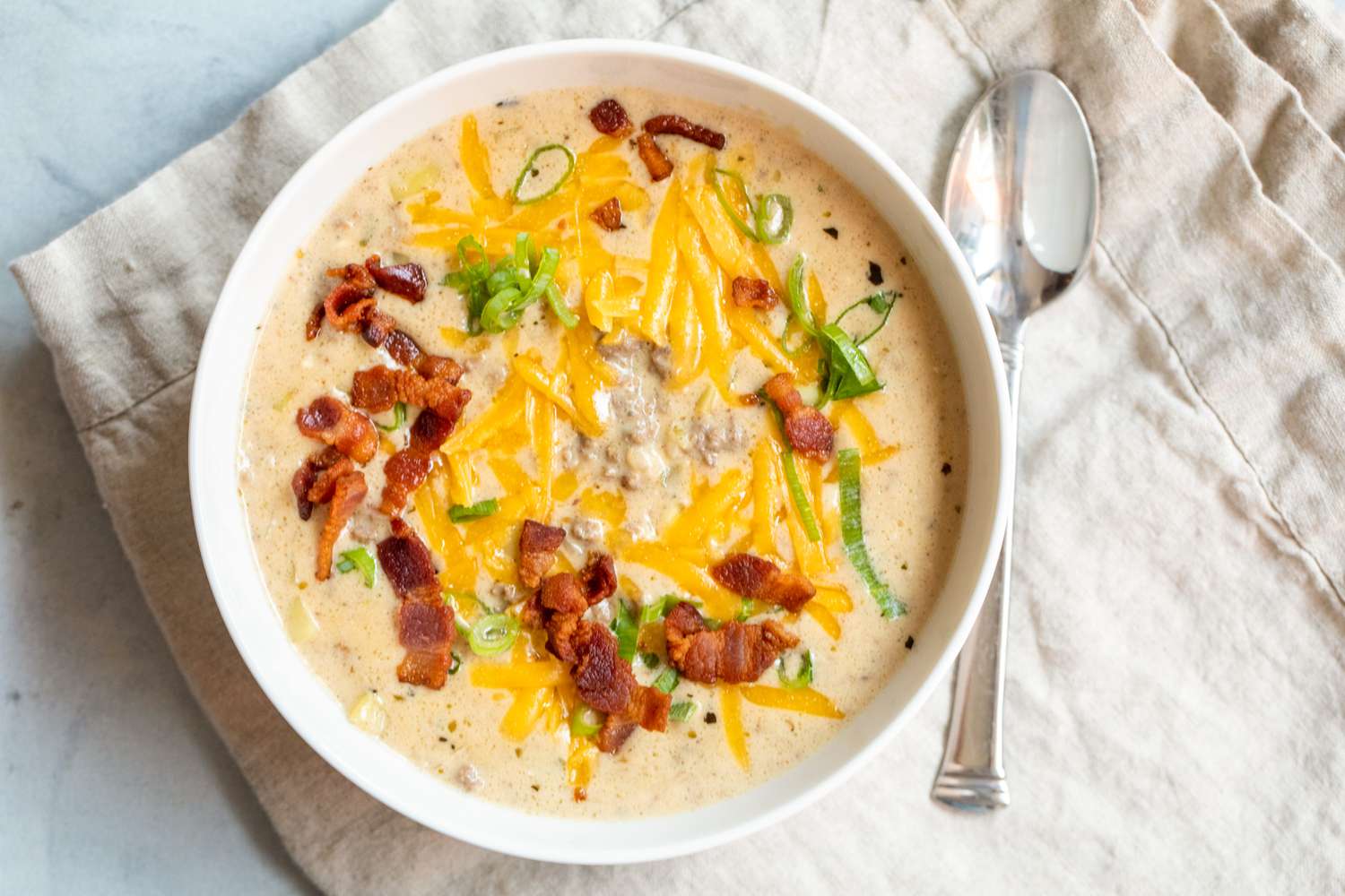 Cheesy bacon cheeseburger soup served for dinner. 