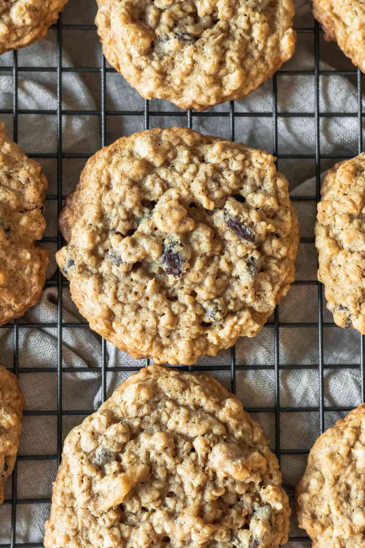 Overhead view of Oatmeal Raisin Cookies cooling on a rack.