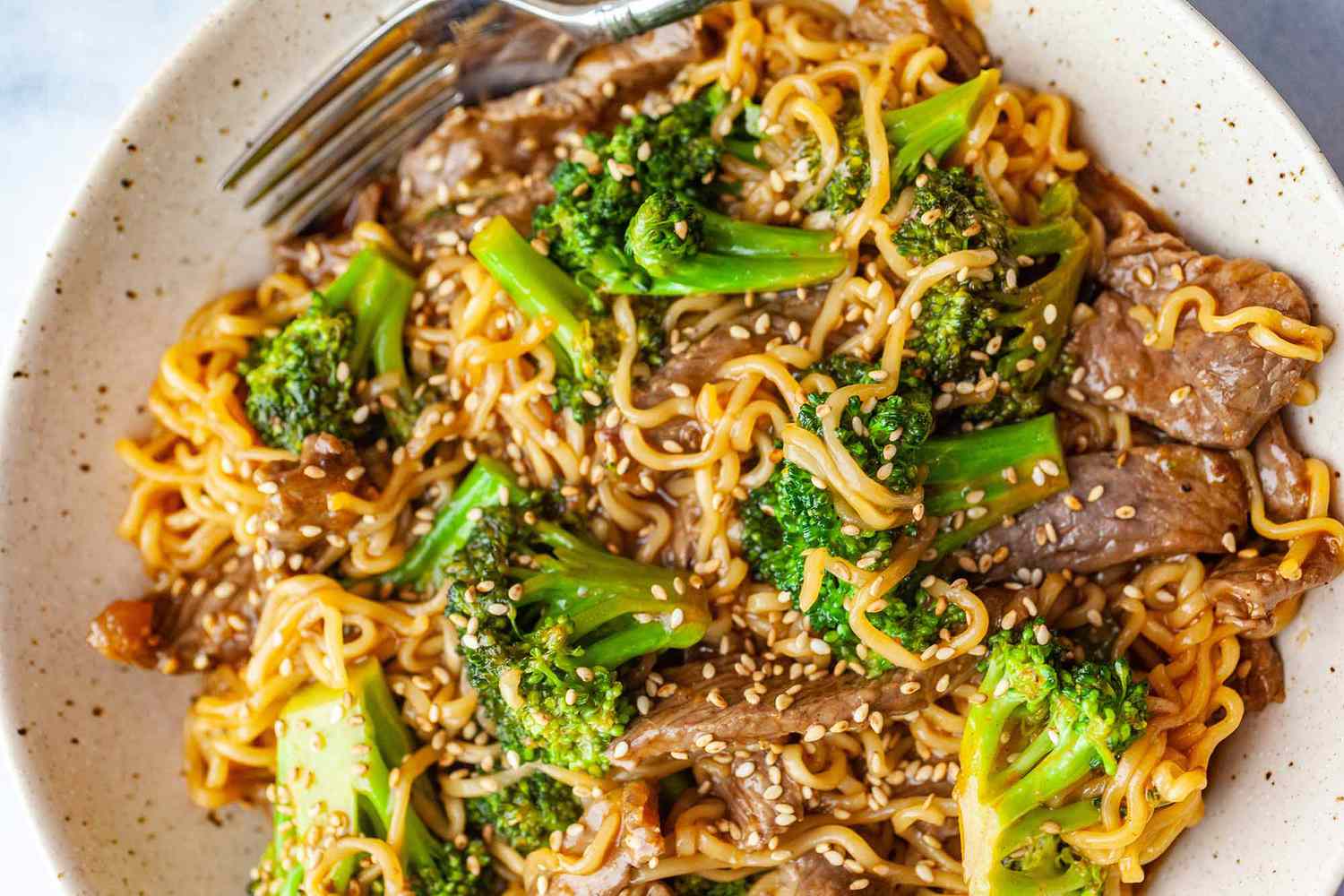 A plate of beef and broccoli ramen stir fry
