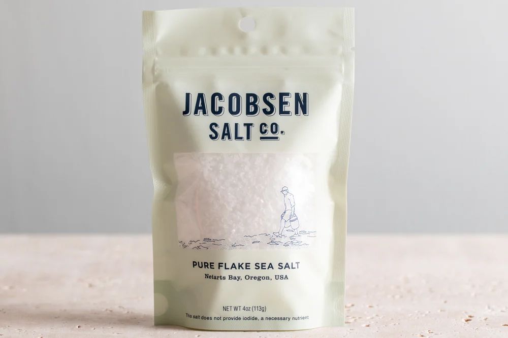 A package of Jacobsen Salt Co Pure Flake Sea Salt on a counter