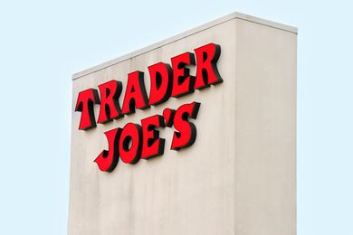 Trader Joes store sign on a vertical white structure