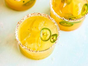 Two margaritas in glasses with Pineapple and Jalapeno