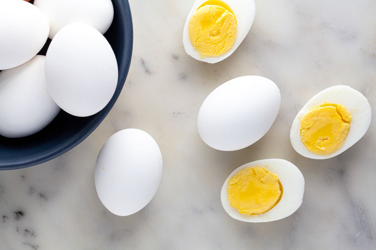 Hard Boiled Eggs - Some Cut in Half, Some in a Bowl