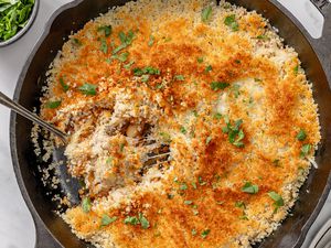 A cast iron skillet with nicely browned baked french onion beans
