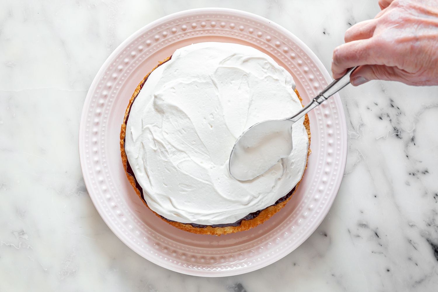 Whipped Cream Spread over Jam and Victoria Sponge Cake
