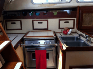 I Live in a 175 Square Foot Tiny Home - A Sailboat Kitchen Picture. Living on a sailboat can be a fun way to live. It is a true tiny home when living on a small sailboat, and you can travel the world at the same time! Are you interested in living on a small sailboat?