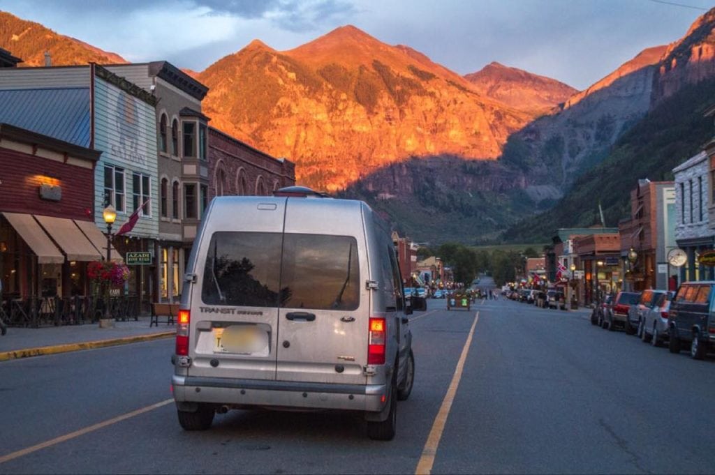 Van life is helping Sarah pay off her debt. Click here to learn more about living in a van and how she built her van dwelling. #vanlife #vandwelling #vanlifehacks #vanlifeDIY #vanlifeideas